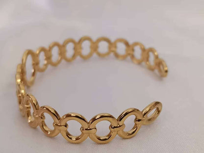 Opengewerkte armband van roestvrij staal, verguld met 18K PVD-goud